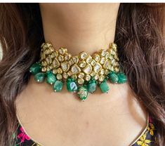 Adorn your beautiful personality with this exquisitely designed and handcrafted Kundan choker set with meenakari back and lined with high quality handpainted green tumbles.  Pair it up with your silks and satins and shine like a glowing star at the next event! Necklace length 14 inches with an adjustable zari dori at the back  Item includes: Necklace, earrings and maangtika  Earrings length 3 inches Each earring weighs 20 gms  Highest quality and craftsmanship  Ready to ship from New Delhi, India Kundan Jewellery Bridal Choker, Wedding Jewellery Indian, Silver Jhumkas, Handmade Wedding Jewellery, Kundan Jewellery Bridal, Sabyasachi Jewellery, Necklace Set Indian, Jewellery Bridal, Kundan Choker