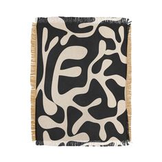 a black and white animal print rug with fringes