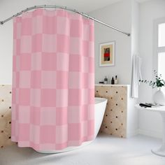 a pink shower curtain in a white bathroom