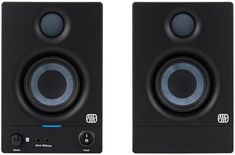 two black speakers sitting next to each other