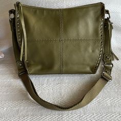 Never Used Green Crossbody Bag By The Sak. Excellent Condition With Inside Zippered And Open Pockets. Small Open Pocket On Back. Fast Shipper - Same Or Next Day Offers Welcomed Green Satchel Shoulder Bag With Snap Closure, Green Leather Bag With Snap Closure, Green Crossbody Shoulder Bag With Snap Closure, Green Leather Shoulder Bag With Snap Closure, Green Tote Shoulder Bag With Snap Closure, Olive Leather Shoulder Bag, Leather Hobo Bag With Snap Closure For Errands, Olive Leather Bag With Adjustable Strap, Olive Leather Shoulder Bag With Detachable Strap