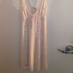 This Is A Shimmery Iridescent Dress From Free People. It Reminds Me Of A Ballet Dress. It Is Adjustable And Tied In The Back. Iridescent Sleeveless Summer Dress, Iridescent Dress For Night Out In Spring, Spring Iridescent Dress For Night Out, Iridescent Dress For Spring Night Out, Summer Pink Shimmer Dress, Iridescent Dresses For Summer Parties, Summer Party Iridescent Dresses, Iridescent Mini Dress For Summer, Iridescent Summer Mini Dress