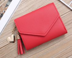 Stylish Red Tri Fold Wallet Heart Tag PU Leather Short Tassel Wallet Minimalist Style  Looking for a minimalist wallet that's perfect for your everyday needs? Look no further than the Short Tassel Wallet! This wallet is made from high-quality, woman-friendly leather. So why not add this stylish and practical wallet to your shopping list today? Please click the store link to find more accessories. We carry a wide variety of purses, straps, hair clips, personalized wallets and jewelry! https://www.etsy.com/shop/southernbellebtqshop/?etsrc=sdt Pink Gift Box, Card Holder Purse, Card Purse, Envelope Wallet, Heart Tag, Red Gift, Personalized Wallet, Wallets For Women Leather, Luxury Wallet