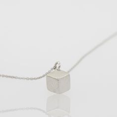 Beautiful Sterling Silver Cable Link Necklace with a 3-Dimensional Cube Pendant Perfect gift for any occasion. About: Cube Dimensions: 5mm X 5mm X 5mm Material: 925 Silver Necklace Length : 18"-20" Cube Necklace, Minimalist Gifts, Trendy Necklaces, Silver 925 Necklace, Link Necklace, Three Dimensional, Sterling Silver Necklaces, Sleek, 925 Silver