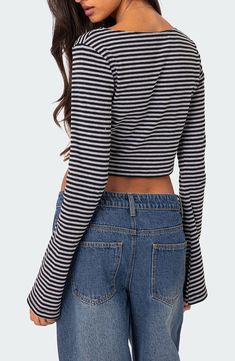 This stretchy cotton top is cut with long, wide sleeves and allover stripes that complement its midriff-baring length. Boat neck Long sleeves 95% cotton, 5% spandex Machine wash, dry flat Imported Striped Long Sleeve Top For Fall, Fitted Top With Striped Sleeves, Fall Striped Long Sleeve Top, Fitted Striped Cotton Crop Top, Cropped Cotton Long Sleeve Top For Spring, Trendy Long Sleeve Cotton Crop Top, Fitted Top With Striped Sleeves For Fall, Striped Cotton Cropped Crop Top, Striped Cotton Crop Top