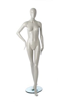 a white female mannequin standing on a round base