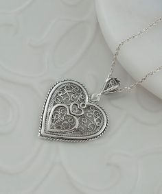 Sterling Silver Edwardian Heart Pendant Necklace , 925 Artisan Made Filigree Handmade Love Jewelry Gift for Women, Her, Mom, Valentine Heart within heart, one of a kind Material: 925 Sterling Silver ( NICKEL FREE ) FREE, FAST AND TRACKABLE SHIPPING FOR ALL EU COUNTRIES AND USA. This beautiful sterling silver heart pendant necklace is a perfect gift for the special women in your life! It features a stunning handcrafted filigree design and comes with a complimentary gift box so you can wrap it up Handmade Silver Heart Necklace For Mom, Sterling Silver Heart Filigree Jewelry, Sterling Silver Filigree Heart Jewelry, Valentine's Day Silver Jewelry With Intricate Design, Elegant Necklaces With Intricate Design For Valentine's Day, Heart-shaped Jewelry With Intricate Design For Valentine's Day, Heart Shaped Jewelry With Intricate Design For Valentine's Day, Valentine's Day Filigree Jewelry For Anniversary, Elegant Handmade Heart Necklace