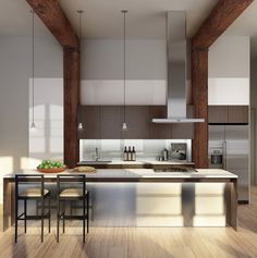 a modern kitchen with wooden floors and stainless steel appliances, along with an island countertop