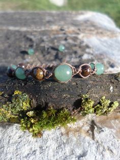 Hello Welcome to LILI M Lithotherapy, Designer of natural stone jewelry in the South of Toulouse since 2014, I invite you to discover my many other models of wellness jewelry with specific virtues: https://www.etsy.com/fr/shop/LILIMLithotherapie Bracelet "anti stress" in natural stones of bronzite and green aventurine - brings inner serenity, strengthens the nerves .. The beads of aventurine and bronzite (size of the pearls: 6 mm and 8 mm for the central aventurine pearl) are mounted on light br Brown Jade Jewelry For Healing, Bohemian Aventurine Bracelets For Healing, Earthy Green Jewelry With 8mm Beads, Nature-inspired Green Bracelets With Natural Stones, Earthy Green Bracelets For Meditation, Earthy Green Bracelets For Healing, Earthy Green Bracelet For Healing, Earthy Green Healing Bracelet, Green Earthy Bracelets With Natural Stones