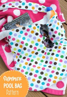 a polka dot towel and sunglasses on a wooden table