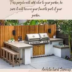 an outdoor kitchen with grill and seating area