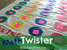 a paper plate with different colored circles on it and the words math twister written in large letters