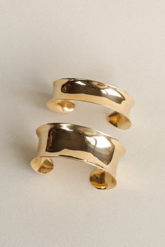 A solid brass cuff with an organic, concave shape. Hand forged, hammered, and buffed to a high polish. Wide style is 1" wide, medium is 3/4" and narrow style is 1/2" and all can be adjusted slightly. We recommend the Polishing Cloth for an easy way to keep this brass cuff shiny. Polished Brass Bangle Cuff Bracelet, Formal Polished Brass Cuff Bracelet, Polished Brass Cuff Bracelet, Elegant Hammered Brass Cuff Bracelet, Classic Hammered Cuff Bracelet, Hammered Yellow Gold Brass Cuff Bracelet, Brass Cuff, Metal Shop, Hammered Metal