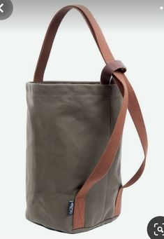 a gray bag with brown straps is shown on the appliance page, and it has