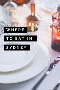 a table set with plates, silverware and candles is featured in an ad for sydney