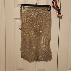 Sexy Size Small Shimmery Lace Embroidered And Glittery Mini Skirt With Zipper In Back. Nwt Elegant Holiday Mini Skirt, Gold Fitted Knee-length Bottoms, Fitted Silver Skirt For The Holidays, Festive Mini Skirt For Party Season, Festive Party Skirt, Sequined Knee-length Bottoms For Night Out, Knee-length Sequined Party Bottoms, Glamorous Fitted Skirt For Festive Occasions, Festive Fitted Lined Skirt