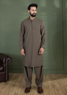 2 Piece - Kurta Shalwar : Skillfully crafted from premium cotton, this classic kurta shalwar for men is a wardrobe staple this season! Details : Plain Front, Plain Back, Band Neck Color: Rust Fabric : Wash & Wear Yarn Dyed Pin Stripes Shalwar Kurta Men, Plain Kurtas For Men, Shalwar Kameez Colors For Men, Mens Kurta Shalwar Design, Kurta Shalwar For Men, Mens Shalwar Kameez 2023, Mens Shalwar Kameez Design Style New, Male Shalwar Kameez Colours, Indian Wedding Suits Men