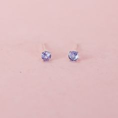 These tiny tanzanite stud earrings are just perfect for a tiny bit of sparkle or for second piercings. They feature recycled sterling silver posts and lovely 3mm genuine, natural stones that reflect a range of colors from blue to lilac, lavender, indigo, violet to purple.  The post is centered on the back of the setting.  Reliable and effortless - exactly the kind of sparkle that I love to add to my day. Gemstone studs: https://www.etsy.com/shop/LotusStone?ref=seller-platform-mcnav&search_query=gemstone+studs Birthstone studs: https://www.etsy.com/shop/LotusStone?ref=seller-platform-mcnav&search_query=birthstone+studs Second piercing: https://www.etsy.com/shop/LotusStone?ref=seller-platform-mcnav&search_query=second+piercing Hoops to Pair: https://www.etsy.com/shop/LotusStone?ref=seller-pl Dainty Purple Gemstone Earrings, Elegant Silver Tanzanite Earrings, Dainty Nickel-free Purple Earrings, Minimalist Accessories Jewellery, Second Piercings, Classic Tanzanite Gemstone Earrings, Colorful Stud Earrings, Tanzanite Studs, Pearl Statement Earrings