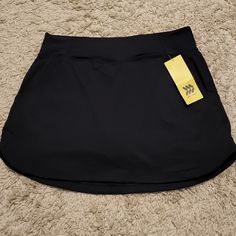 New Athletic Skort Has Pockets On Both Sides Solid Black Moisture-wicking Black Skort For Sports, Black Moisture-wicking Skort For Sports, Black Athleisure Skort With Go-dry Technology, Black Athleisure Skort With Go-dry, Black Short Tennis Skirt For Gym, Black Tennis Skirt For Gym, Sporty Black Skort With Go-dry Technology, Black Athleisure Skort With Moisture-wicking, Black Tennis Skirt With Pockets For Sports