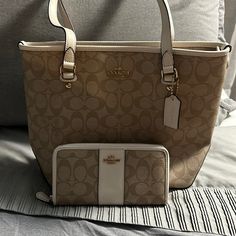 Coach Signature Zip Top Tote With Matching Wallet F58294 Tan/Cream Signature Coated Canvas Inside Zip, Cell Phone And Multifunction Pockets Zip-Top Closure, Fabric Lining Handles With 8 3/4' Drop 10 1/2" (L) X 10 1/4" (H) 4 1/4" (W) Classic Everyday Cream Wallet, Everyday Cream Wallet With Interior Card Slots, Elegant Cream Wallet For Everyday Use, Elegant Cream Wallets For Everyday Use, Luxury Beige Wallet For Everyday Use, Luxury Everyday Beige Wallets, Luxury Beige Wallet, Luxury Beige Everyday Wallet, Classic Cream Wallets For Daily Use