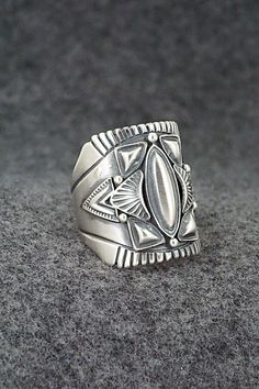 This finely crafted sterling silver ring was made by Navajo silversmith Derrick Gordon. The back is signed Derrick and stamped sterling.Size: 10Length: 1"Free shipping on all orders! We ship with USPS and always include tracking. All orders ship within a day of payment.Returns are accepted up to 30 days after you receive your order. Just send us a message. Our shop offers cash back or store credit. The item must be returned in new condition. Silver Southwestern Style Rings, Southwestern Style Untreated Silver Rings, Artisan Silver Ring With Concho, Unique Silver Ring With Concho Detail, Silver Bohemian Concho Rings, Bohemian Silver Concho Rings, Happy Valentines Day, Happy Valentine, Bracelets For Men