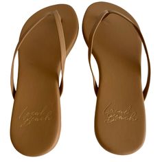 Local Beach Classic Slim Flip Flop silhouette . Vegan and mimicking the performance of leather. Cushioned insole and rubber outsole provides extra comfort and function. Slim & Cute. Made to Last. Fit and Details Vegan Leather Upper with matching Slim Strap Rubber Outsole Available in whole sizes Wipe clean with a damp cloth Ortholite Insole Flat Flip Flops For Beach, Classic Slip-on Beach Flip Flops, Classic Flat Flip Flops For The Beach, Classic Beach Slip-on Flip Flops, Classic Beach Flip Flops, Synthetic Single Toe Strap Flip Flops With Rubber Sole, Cushioned Flat Synthetic Flip Flops, Brown Synthetic Flat Heel Flip Flops, Brown Synthetic Flip Flops