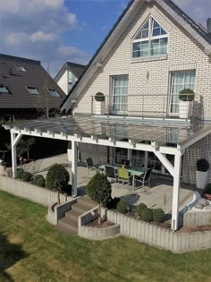 a house with a covered patio in front of it