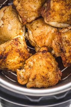 cooked chicken in an air fryer basket