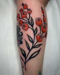 a woman's arm with flowers and butterflies on it