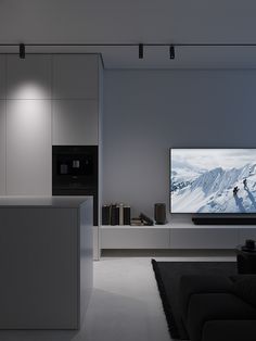 a large flat screen tv mounted to the side of a wall in a living room