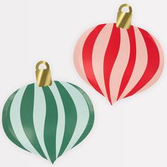 two christmas ornaments are shown on a white background, one is red and the other is green