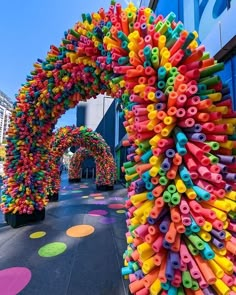 an arch made out of colorful plastic objects