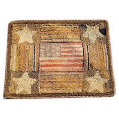 a rug with an american flag on the front and back of it, all in different colors