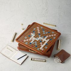 a board game sitting on top of a table next to a wallet and pen holder