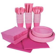 pink tableware and napkins are arranged on top of each other