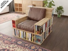 a chair made out of books on top of a wooden floor next to a rug