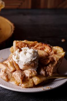 a white plate topped with waffles covered in ice cream