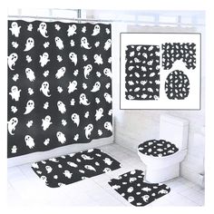 the bathroom is decorated in black and white with spooky ghost designs on it