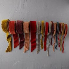 multicolored scarves hanging on the wall