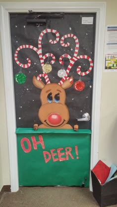 a door decorated with candy canes and a reindeer on it's head that says, oh deer