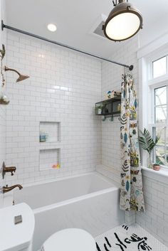 a bathroom with a toilet, sink and bathtub