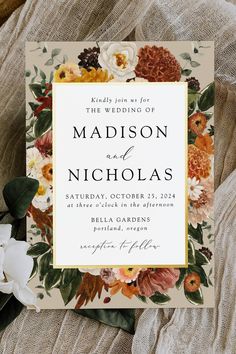 a wedding card with flowers on it