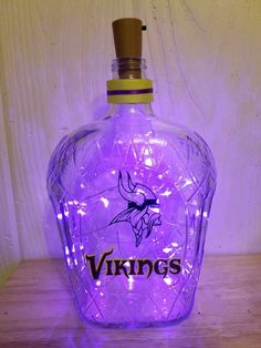 a purple glass bottle with the word minnesota on it