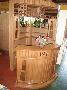 a wooden bar sitting inside of a living room