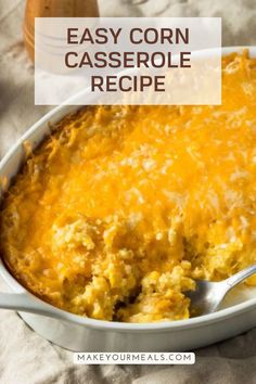 an easy corn casserole recipe in a white dish with a spoon