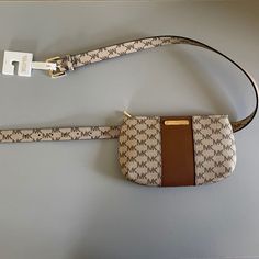 Michael Kors Brown Logo Belt Bag- S/M - New With Tags - Size S/M - Gold Hardware - Adjustable Belt, 7 Different Belt Holes - Vegan - Zipper Top Closure - Inside Card Pocket Travel Belt Bag With Branded Hardware, Brown Belt Bag With Gold-tone Hardware, Casual Beige Bag With Branded Hardware, Brown Logo, Oversized Clutch, Mk Handbags, Leather Camera Bag, Bags Michael Kors, Browning Logo