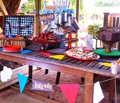 a picnic table with food and decorations on it