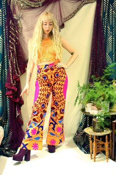 "Beautiful high waisted cotton flares made from handmade Indian Suzani embroidered fabric. The floral design has been hand stitched so each pair is totally unique. These 70's inspired trousers have a zip and hook fastening and feature back pockets. If you're looking for a retro and bohemian bold piece then look no further... Not only are they eye catching, but extremely comfortable. Please note: As each pair of flares is made completely from scratch the pair you receive may differ very slightly to the images above.  Model wears a size S, is a U.K 8-10 and 5'5\" tall :)  { Measurements }  XS Waist: 24\" Hips: 39\" Front Rise: 12\" Inside Leg: 31\" Full length: 42\" S Waist: 27\" Hips: 42\" Front Rise: 12\" Inside Leg: 31\" Full length: 42\" M Waist: 28\" Hips: 44\" Front Rise: Inside Leg: Fitted Cotton Hippie Pants, Fitted Hippie Cotton Pants, Fitted Cotton Harem Pants For Festivals, Fitted Cotton Pants For Festival, Embroidered Cotton Wide-leg Pants, Embroidered Cotton Wide Leg Bottoms, Hippie Wide-leg Cotton Pants, Multicolor Full Length Cotton Pants, Stretch Embroidered Wide Leg Bottoms