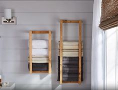 two towels are hanging on the wall in this bathroom