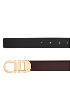 A high-polish Gancio buckle brings Ferragamo's signature motif to the front of a belt crafted for simplicity and distinction from glossy black leather. Leather Made in Italy Designer Calf Leather Belt Buckle, Designer Calf Leather Belt Buckles, Luxury Black Belt With Rectangular Buckle, Luxury Belts With Rectangular Buckle, Luxury Belts With Rectangular Buckle Closure, Luxury Business Belts With Buckle Closure, Luxury Belts With Buckle Closure For Formal Occasions, Luxury Formal Belt With Buckle Closure, Luxury Business Belt With Gold Buckle